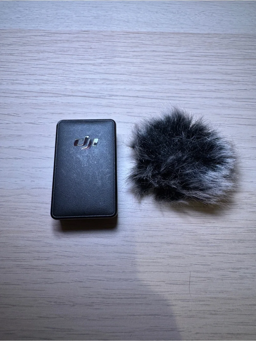 DJI Mic 1 transmitter and Gray Furry Wind Muff